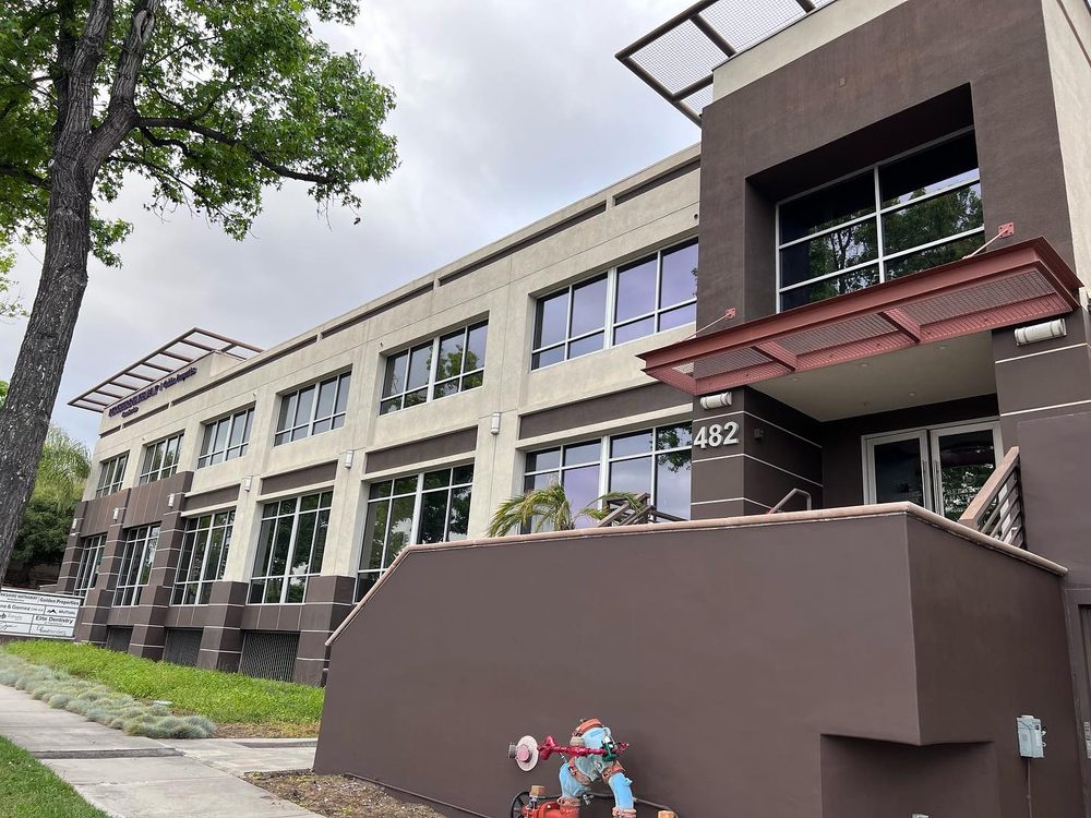 Solar control film installed across the windows of a two-story office building in the Los Angeles area