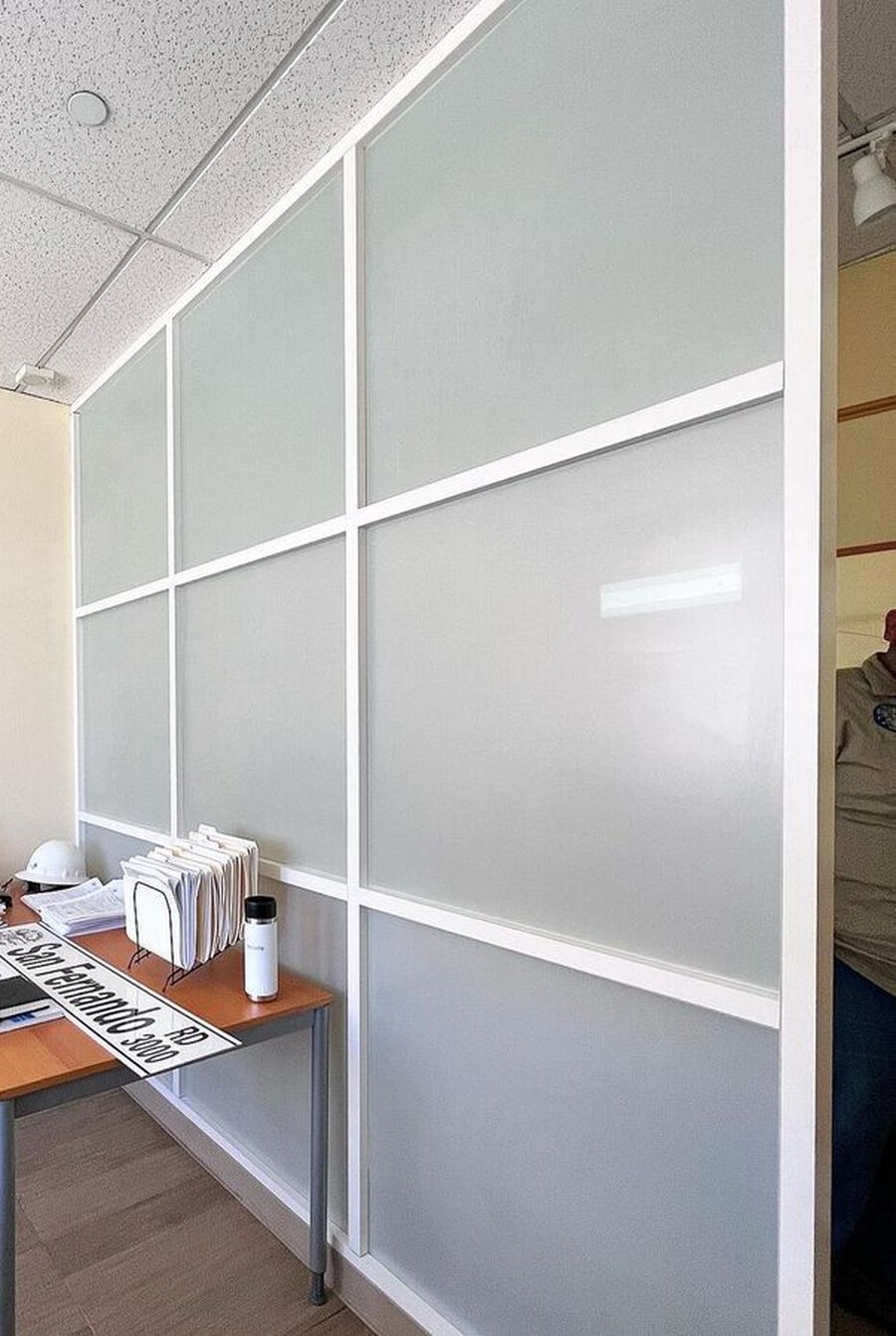 Frosted privacy film installed on a floor-to-ceiling office glass partition in Los Angeles