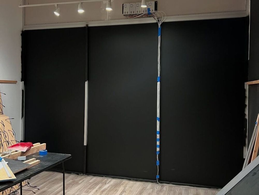Blackout film installed on a full-height interior glass wall in a Los Angeles studio space