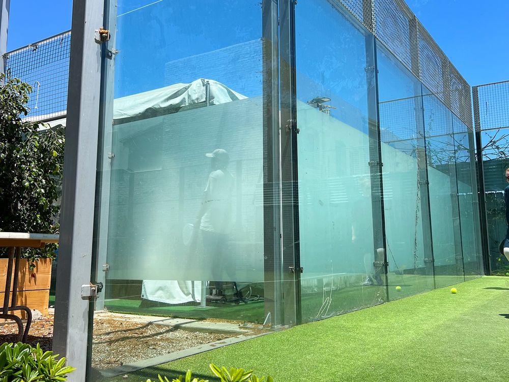 White opaque privacy film installed on glass panels at a Los Angeles tennis club