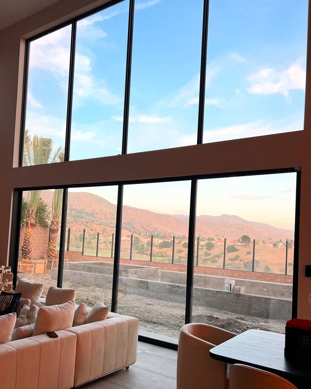 Solar control film on floor-to-ceiling living room windows of a Los Angeles home