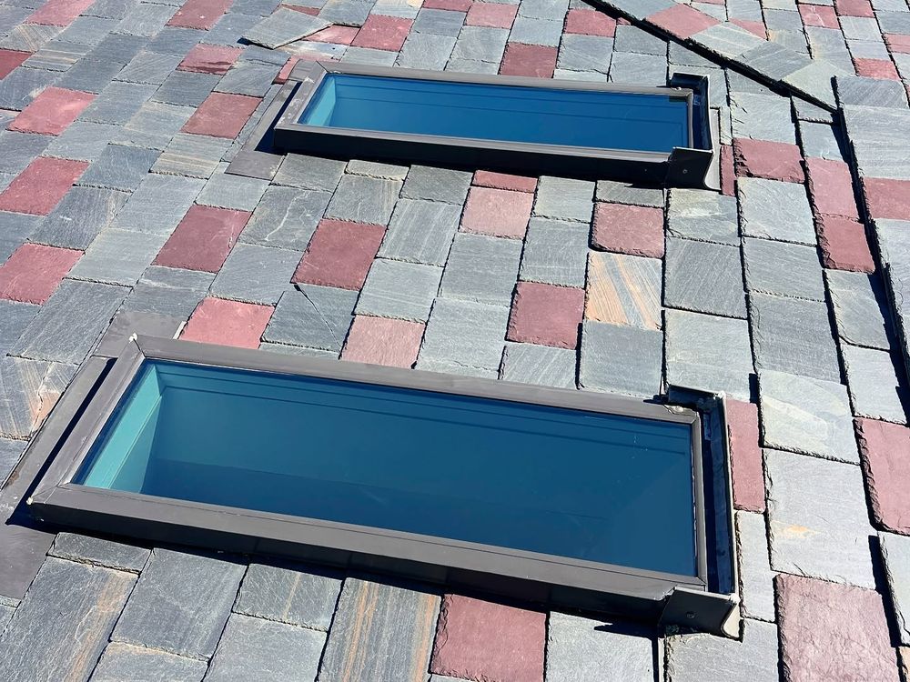 Two rooftop skylights with sun protection film installed on a Los Angeles hillside home