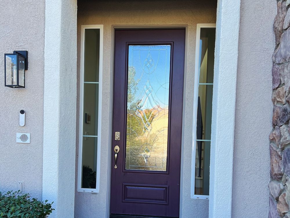 Clear safety film installed on a residential entry door and its glass sidelights in Los Angeles
