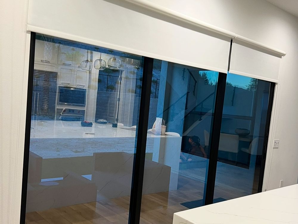 Protective anti-vandal solar film installed on residential sliding glass doors in Los Angeles