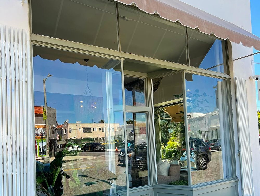 Glass polishing and anti-graffiti film installation on a retail storefront in Hollywood, Los Angeles